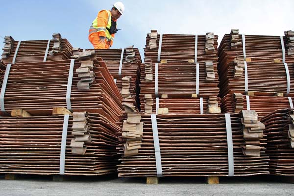 A security guard inspects a shipment of copper ready to be delivered in Valparaiso city